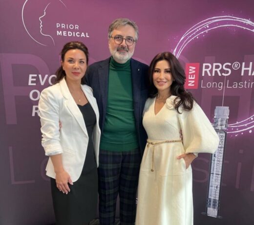 Group photo of PriorMedical training faculty in front of the RRS HA Long Lasting backdrop