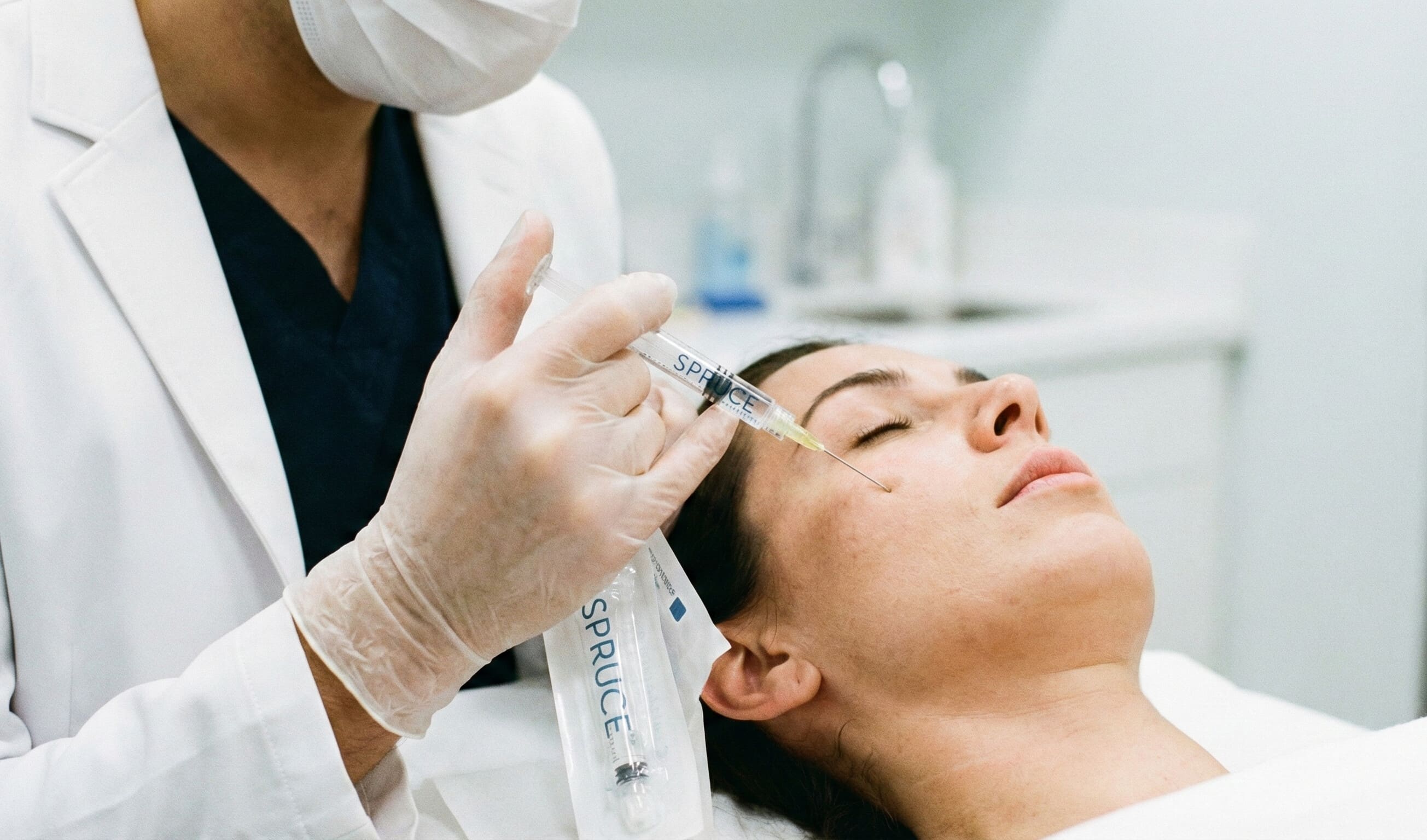 Aesthetic medicine physician using a cannula during an injectable procedure in a clinic